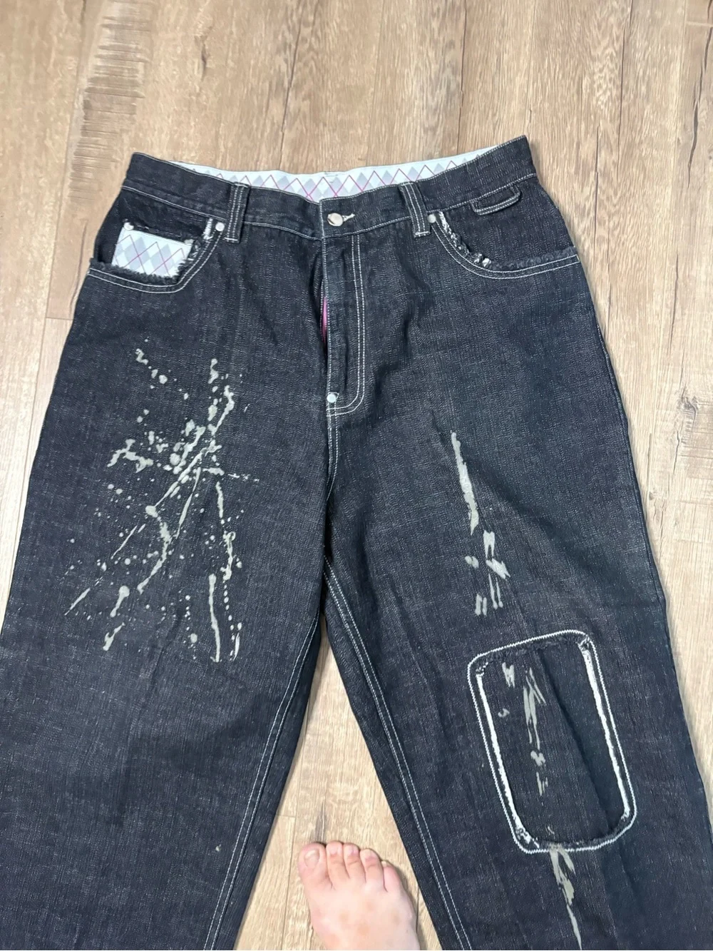 These wide-leg black jeans with white paint splatters Size 36x28